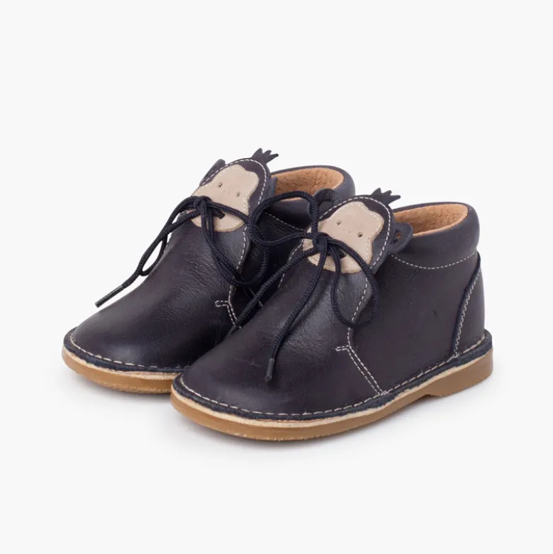 Botita piel cordones cara monito
