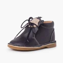 Botita piel cordones cara monito